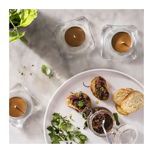 PRAKTRÖNN scented candle in metal cup, 9 hr, spring herbs/yellow-brown