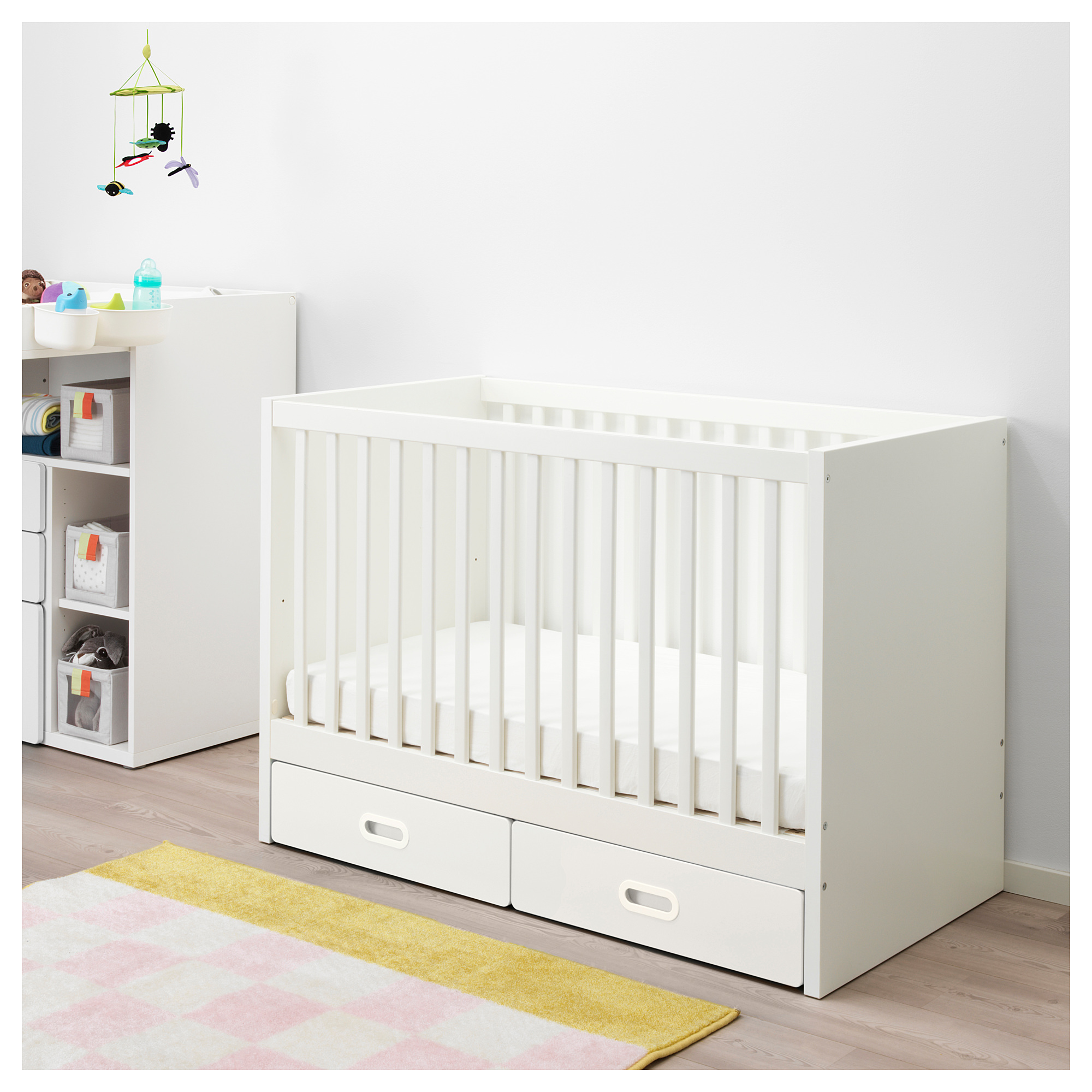 grey cot with drawers