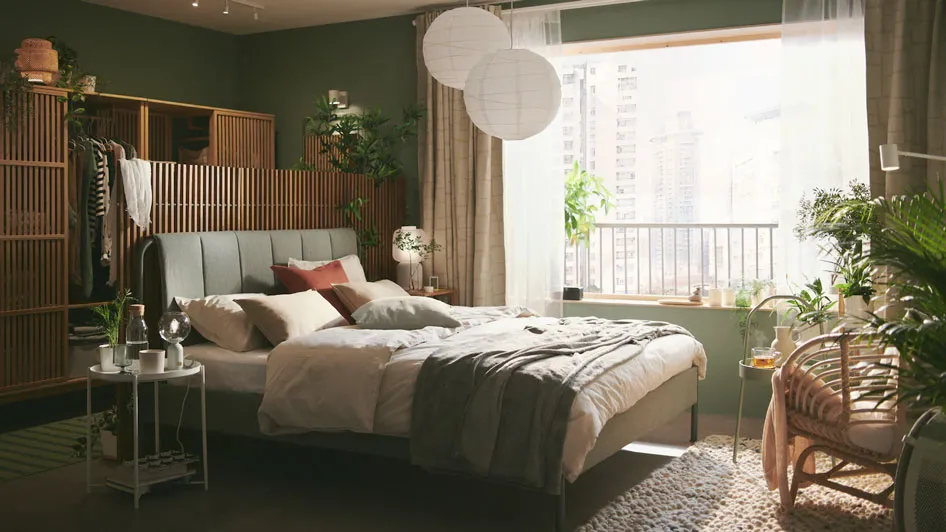 A serene and calm green bedroom that feels close to nature