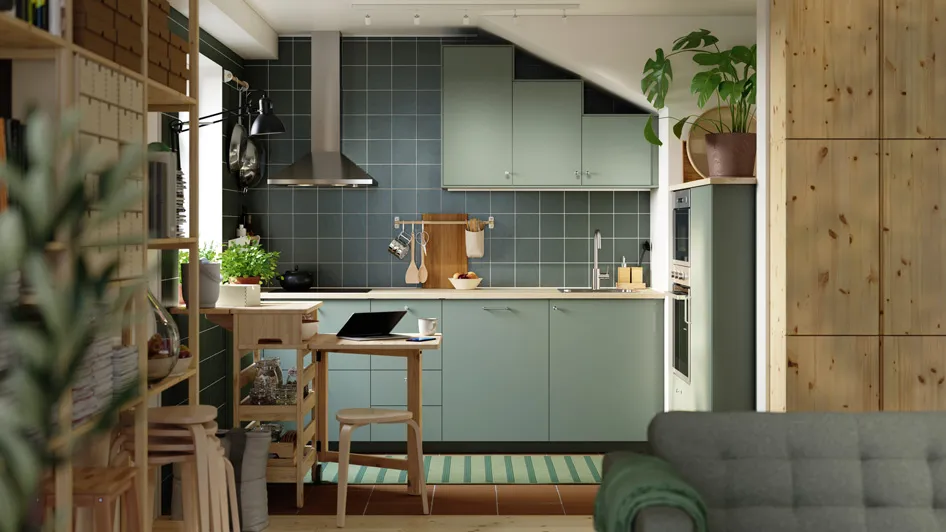 A sage green kitchen made for small space living