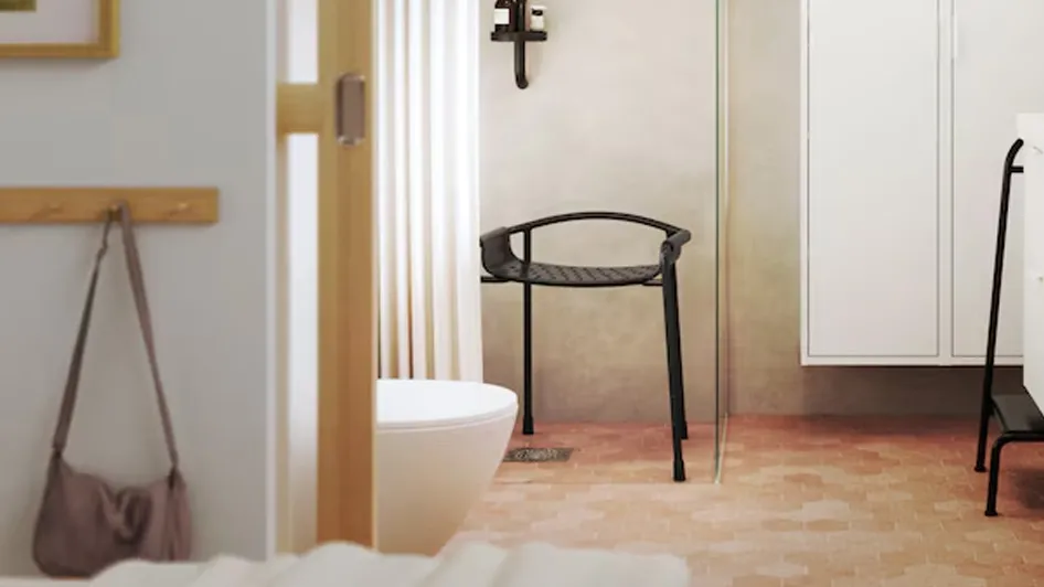 A bathroom in earthy tones with dark contrasts